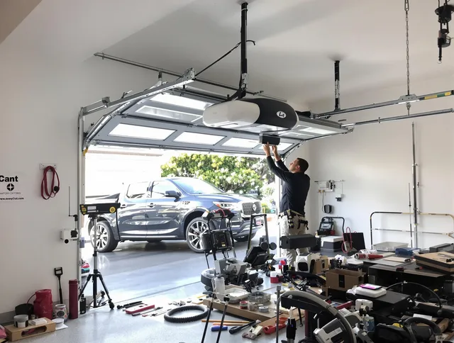 Parma Garage Door Repair specialist installing smart garage door opener system in Parma home