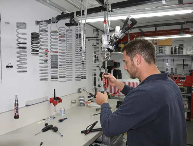 Parma Garage Door Repair safety certified technician performing precision spring replacement in Parma
